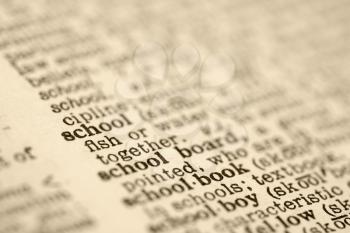 Royalty Free Photo of a Selective Focus of a Dictionary Definition for The Word School