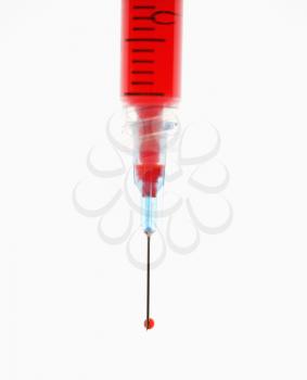 Royalty Free Photo of a Hypodermic Needle Filled With Red Liquid