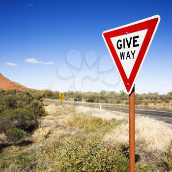 Royalty Free Photo of a Humorous Road Sign Reading Give Way in Rural Australia