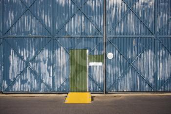 Royalty Free Photo of an Exterior of a Building With a Door and Metal Siding, Australia