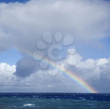 Royalty Free Photo of the Seascape of the Pacific Ocean near Maui, Hawaii With Rainbow and Clouds