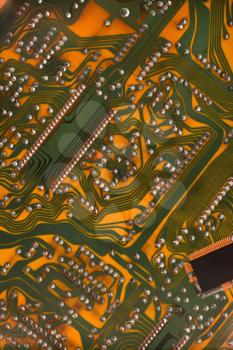Orange circuit board detail.