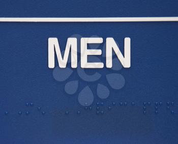 Royalty Free Photo of a Blue Men Sign With Braille