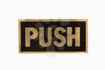 Push sign with gold text against white background.