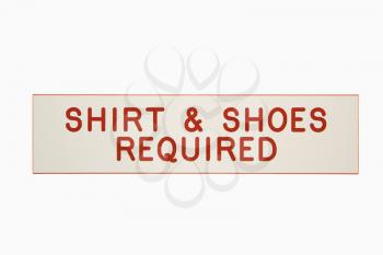 Royalty Free Photo of a Shirt and Shoes Required Sign
