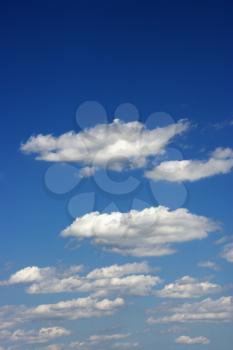 Royalty Free Photo of Puffy White Clouds in a Blue Sky