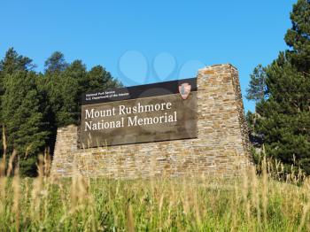 Royalty Free Photo of  a National Park Service Sign for Mount Rushmore