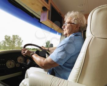 Royalty Free Photo of an Older Woman Driving an RV