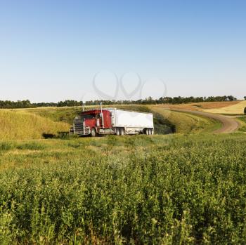 Royalty Free Photo of a Semi Tractor Truck on a Rural Road