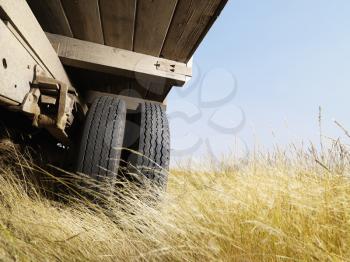 Royalty Free Photo of a Low Angle View of a Farm Truck in a Field