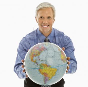Royalty Free Photo of a Middle-aged Man Holding Out a Globe