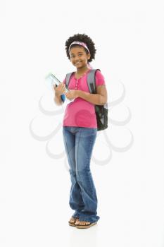 Royalty Free Photo of a Girl Holding Books and Wearing a Backpack