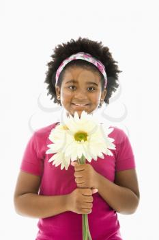 Royalty Free Photo of a Girl Holding a Gerber Daisy 