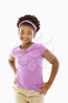 Royalty Free Photo of a Girl With Her Hands on Her Hips Smiling
