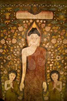 Royalty Free Photo of Buddha and Two Disciples on an Old Temple Cotton Scroll From Thailand.