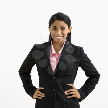 Royalty Free Photo of a Smiling Businesswoman With Hands on Her Hips