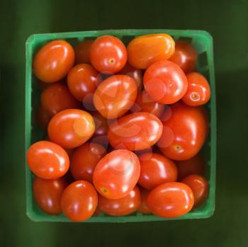 Royalty Free Photo of a Container of Red Cherry Tomatoes