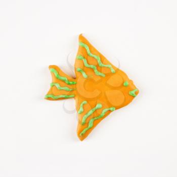 Sugar cookie in shape of a fish with decorative icing.
