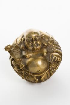Happy laughing Buddha brass figurine on white background.