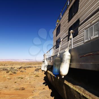 Royalty Free Photo of a Landscape of a Houseboat Sitting in the Middle of the Desert in Rural Arizona, United States