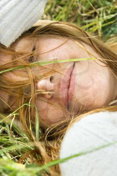 Royalty Free Photo of a Woman Laying in the Grass