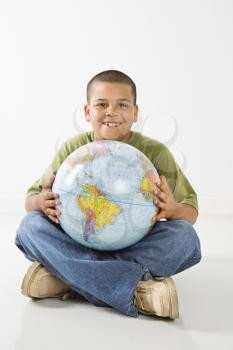 Royalty Free Photo of a Young Boy Holding a Globe