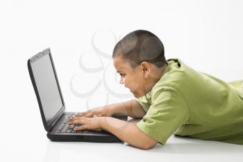 Royalty Free Photo of a Boy Using a Laptop