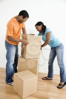 Royalty Free Photo of a Couple Packing Together