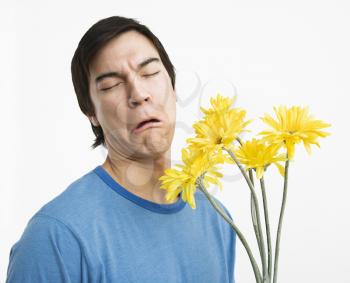 Royalty Free Photo of a Man Holding a Bouquet of Daisies 