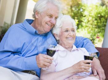 Royalty Free Photo of a Senior Couple With Wine Outdoors