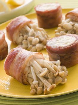 Royalty Free Photo of Enoki Mushrooms Wrapped in Smoked Bacon