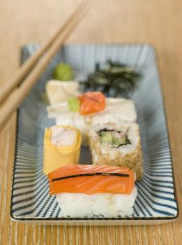 Royalty Free Photo of Plated Sushi With Wasabi Sushi Ginger and Nori
