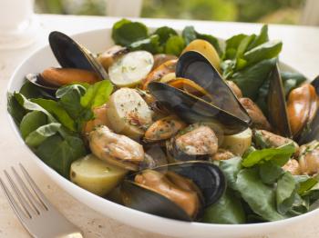 Royalty Free Photo of Mussel Watercress and Potato Salad