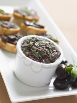 Royalty Free Photo of Black Tapenade on Toasts