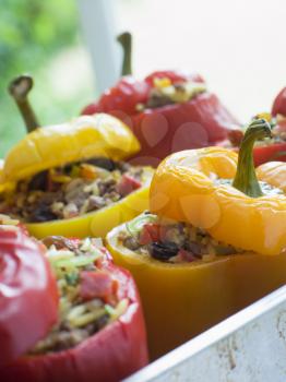 Royalty Free Photo of Bell Peppers Stuffed with Spiced Rice and Dried Fruits