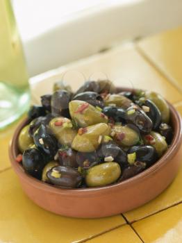 Royalty Free Photo of a Dish of Mixed Marinated Olives