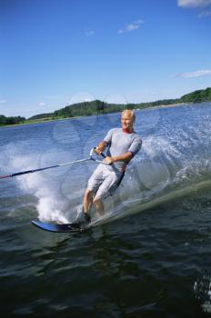 Royalty Free Photo of a Man Water Skiing
