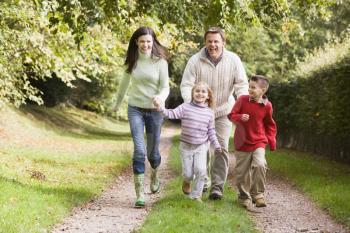 Royalty Free Photo of a Family Walking on Trails
