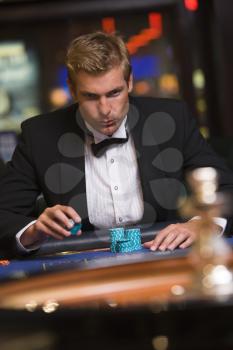 Royalty Free Photo of a Guy at a Casino Table