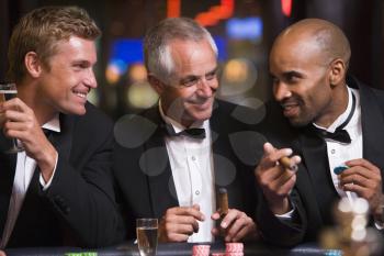 Royalty Free Photo of Three Men at a Casino