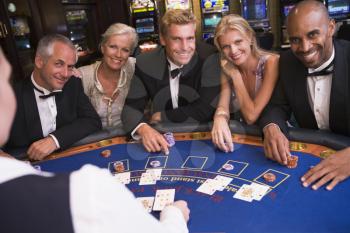 Royalty Free Photo of Five People at a Blackjack Table