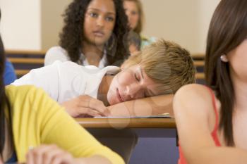 Royalty Free Photo of a Student Sleeping in Class