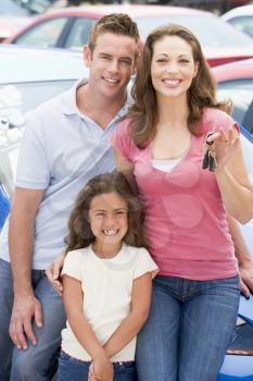 Royalty Free Photo of a Family With a New Car