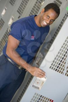 Royalty Free Photo of a Firefighter at His Locker