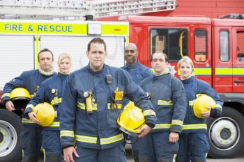 Royalty Free Photo of Firefighters in Front of the Rescue Vehicle