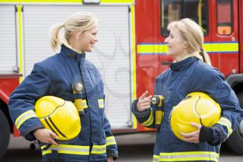 Royalty Free Photo of Two Women Firefighters Talking