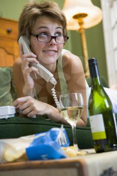 Royalty Free Photo of a Young Woman Talking on the Telephone
