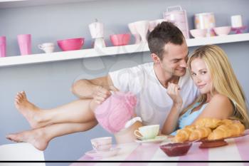 Royalty Free Photo of a Young Couple Having Breakfast
