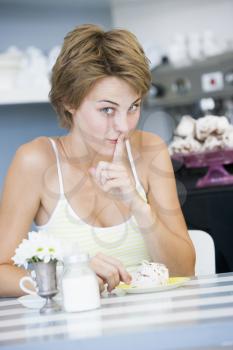 Royalty Free Photo of a Woman About to Eat a Sweet Treat