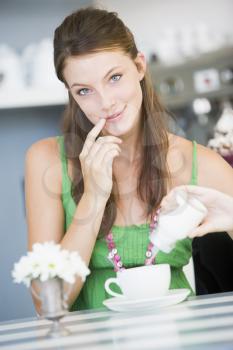 Royalty Free Photo of a Woman Having Tea